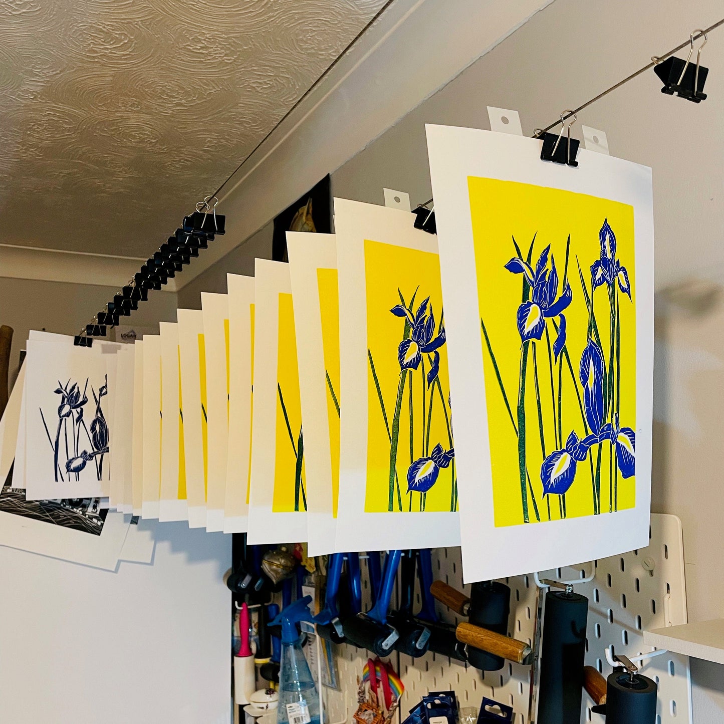 Blue Irises in a bright sunny yellow background lino print