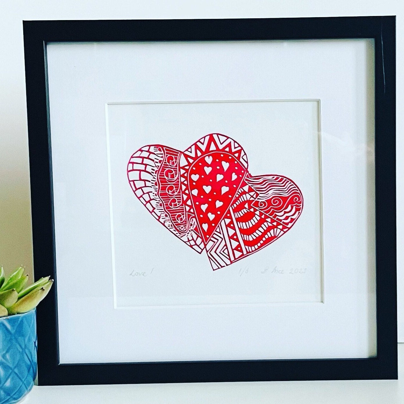Red hearts entwined, ideal occasion gift idea. This is an original lino print, handmade and handprinted artwork